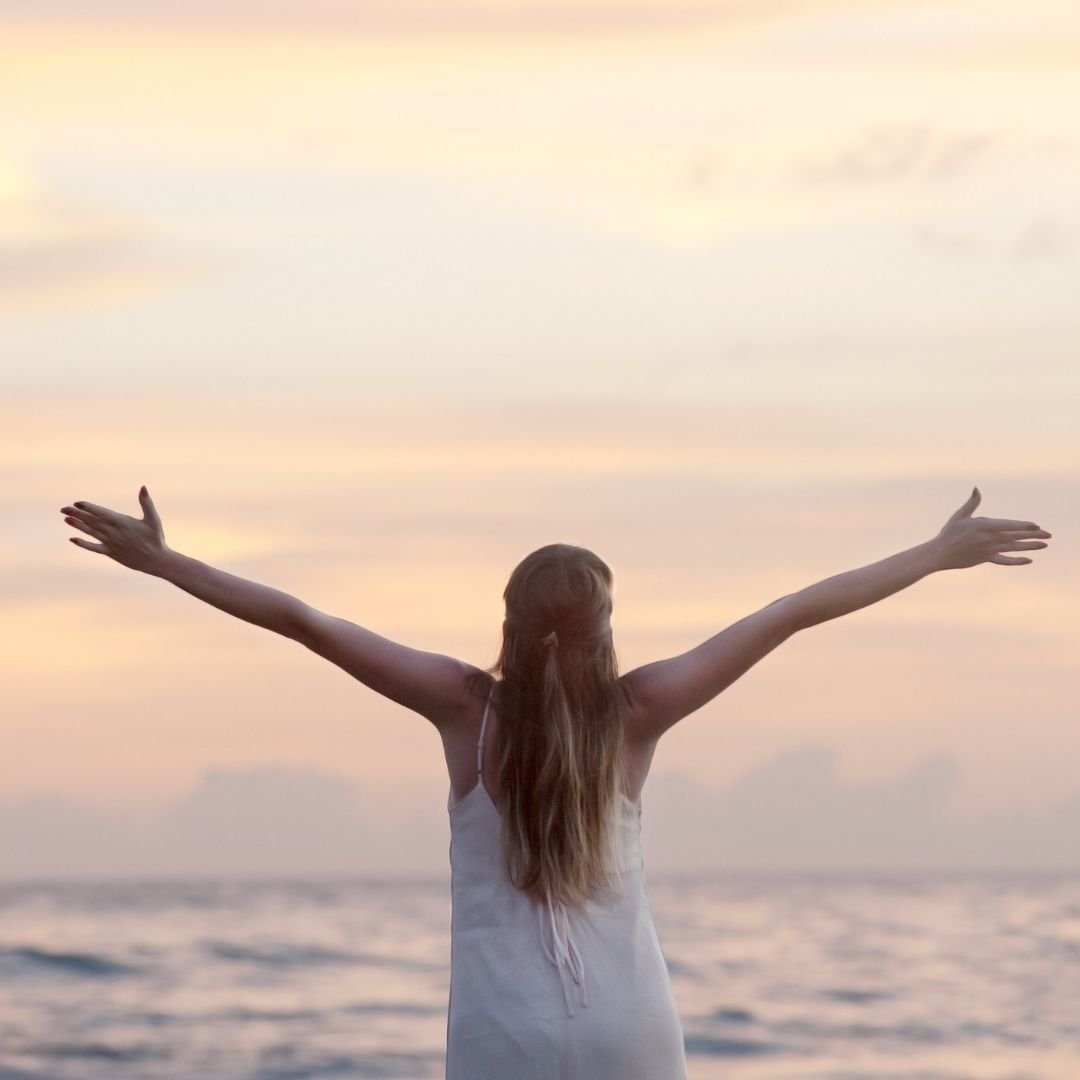 Happy Woman at the Beach with Spread Arms-Skilled Regional visa (subclass 887) -widen migration experts Happy Woman at the Beach with Spread Arms-Skilled Regional visa (subclass 887) -widen migration experts